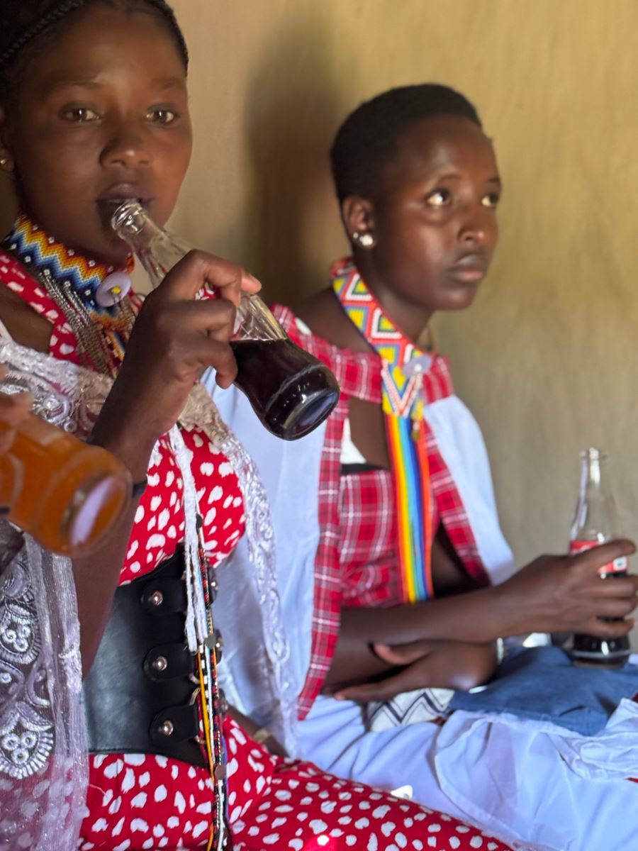 Drinking soda that we were offered in the ceremony.