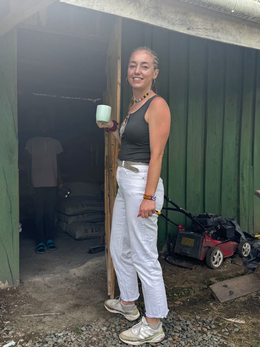 Posing for a Photo while having some morning coffee at the store door.