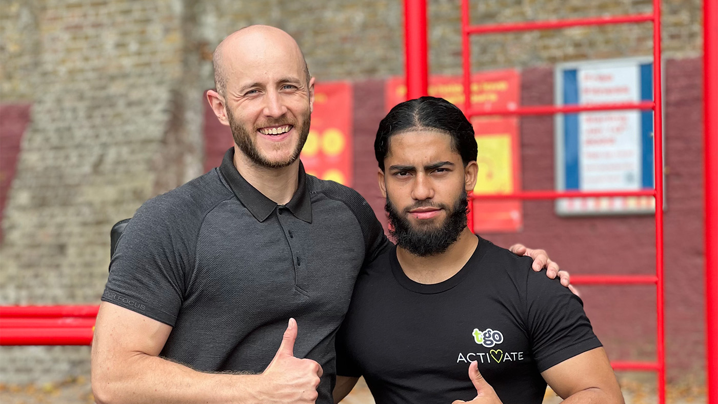 portrait of two men at a gym